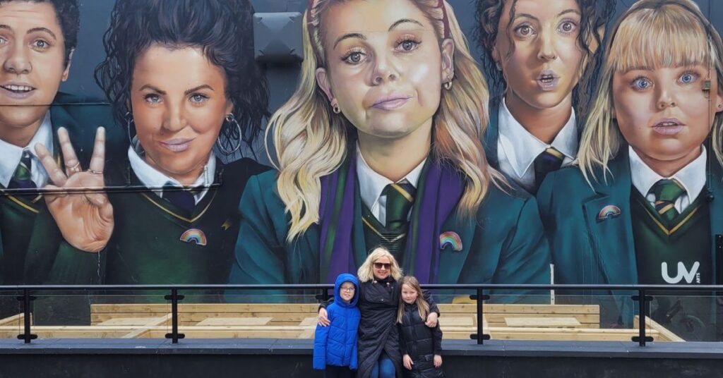 Me and children Derry Girls Mural